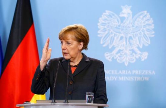 German Chancellor Angela Merkel addresses to media after meeting Polish Prime Minister Donald Tusk in Warsaw March 12, 2014. Merkel is visiting Poland to discuss the crisis in Ukraine. REUTERS/Kacper Pempel (POLAND - Tags: POLITICS)